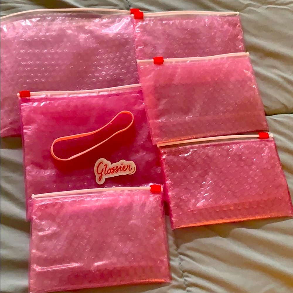 Glossier pink pouches & sticker